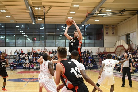 The Reds Chris Spurrell puts up two of his 19 points in Friday's 79-64 win over Acadia. (Photo: Acadia Athletics)