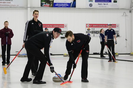 The UNB Reds men's curling team competes on day one of the Subway Atlantic University Sport Curling Championships, in St. John's, NL. UNB lost 8-4 to Saint Mary's in their only game of the day. (Photo: Dani Ahmed/for Memorial Athletics)