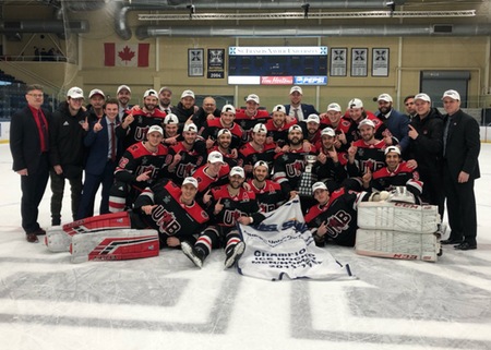 The UNB Reds and the 2018-19 AUS men's hockey championship banner. (Photo: St FX Athletics)