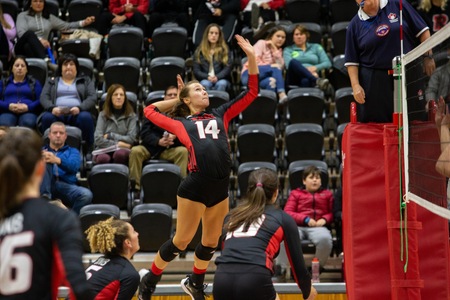 UNB's Adora Rooyakkers attacks during Sunday's 3-0 Reds win over Moncton. Rooyakkers had 10 digs for the Reds in the match. (Photo: James West/for UNB Athletics)