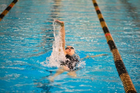 UNB's Leah Smal races to victory in the women's 200 metre backstroke, at the 2019 Subway AUS Swimming Championships, in Halifax. Smal captured a total of seven medals, including three gold, on the weekend. (Photo: Trevor MacMillan/for Dal Athletics)