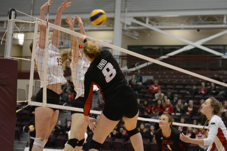 UNB's Victoria Eadle drives the ball past a Memorial block during Sunday's 3-1 win over the Sea-Hawks. (Photo: Dani Ahmad/for Memorial Athletics)